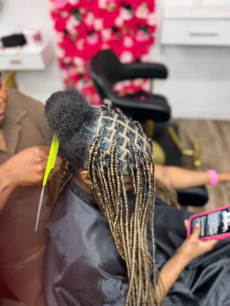 Client protective hairstyle by Melanie Hair Braiding